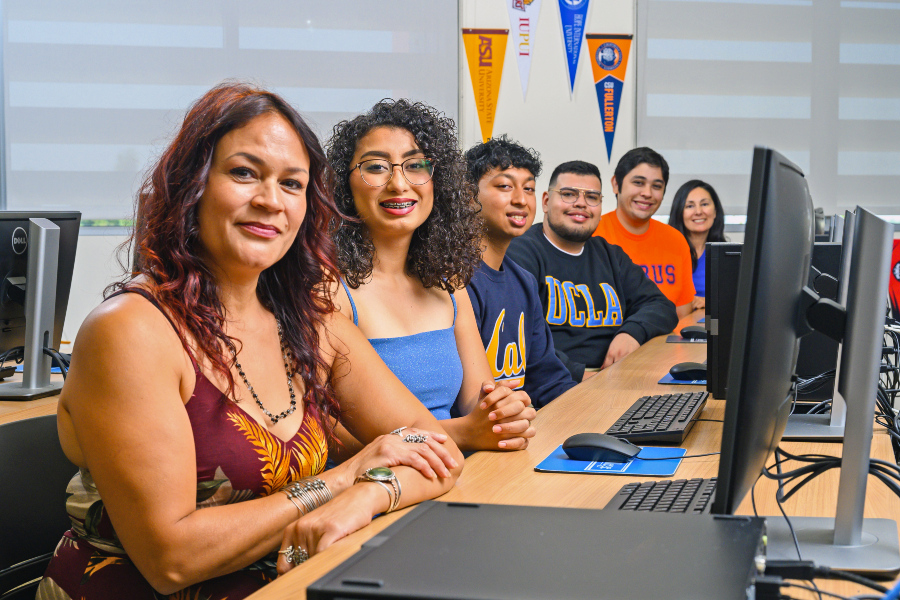 students and faculty sit together in a computer lab to highlight open educational resources and zero textbook cost options