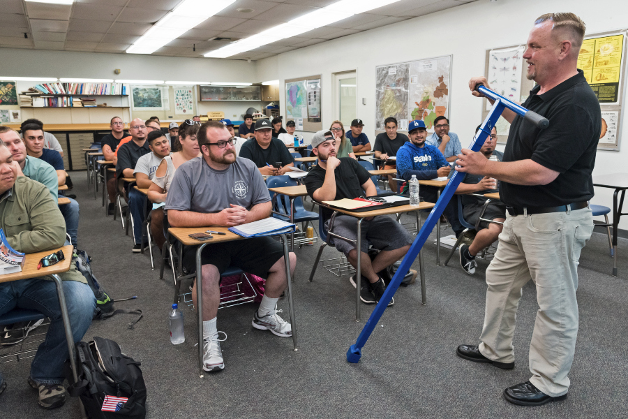 water tech instructor lecturing in front of a full class