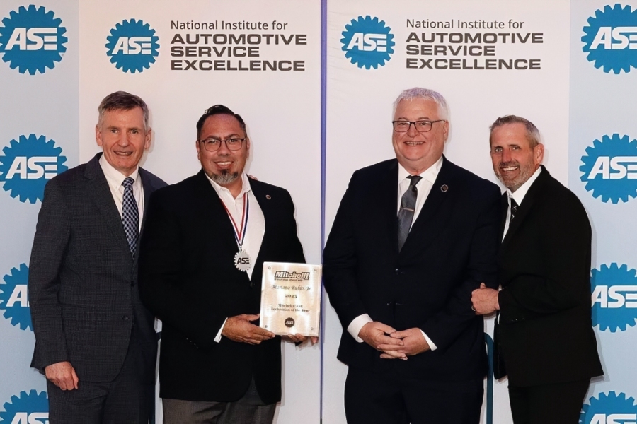 dave johnson, mariano rubio, thomas southward and jason rainey pose at an ase awards event as rubio displays his 2025 mitchell 1/ase master technician of the year plaque and medal