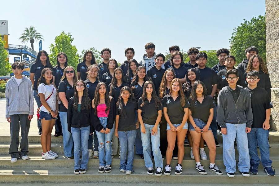 Azusa High School students pose together on outdoor steps during a Citrus College campus visit