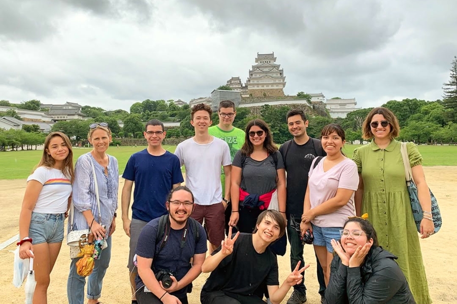 citrus college study abroad students and instructors pose in front of himeji castle in hyogo prefecture, japan, beneath an overcast sky