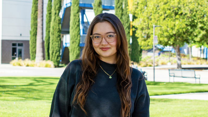 Terra James with the Educational Development Building in the background