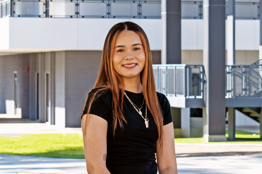 Yadira Alvarez with the ED building in the background