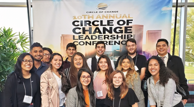 students pose together at the 10th annual circle of change leadership conference